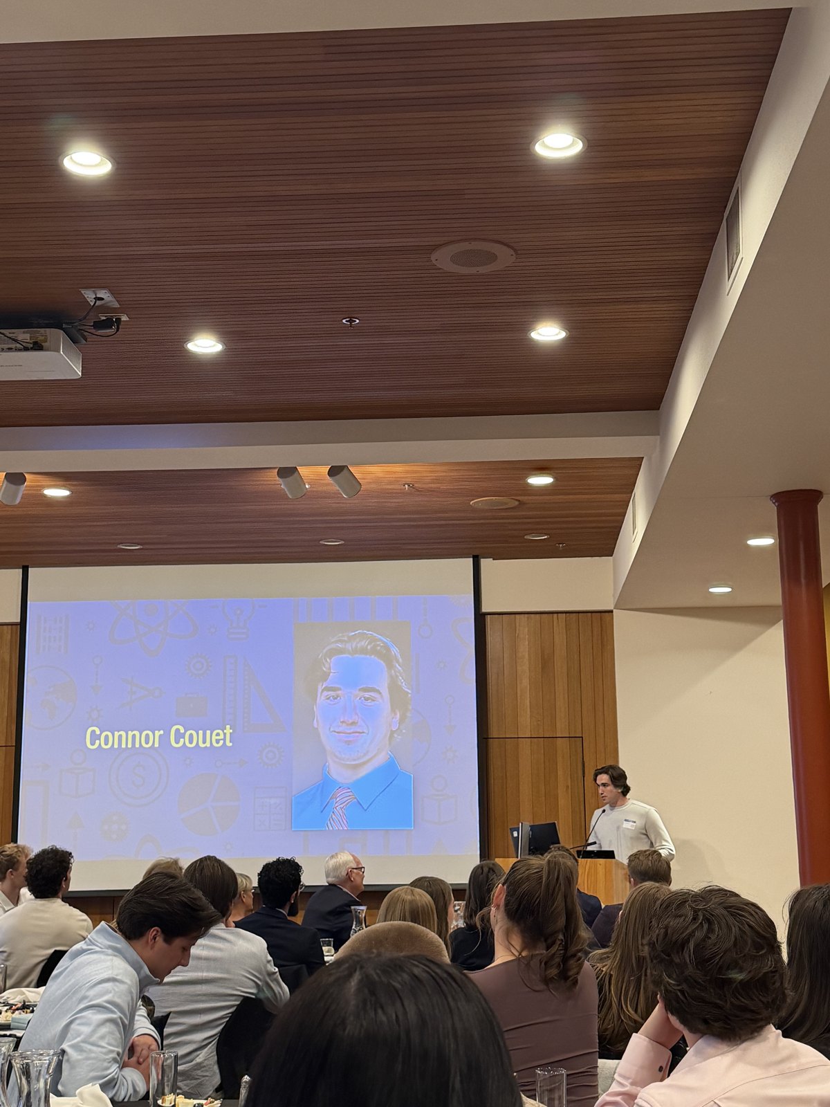 Conner Couet presenting at E-Scholars Pitch Night at CSB and SJU