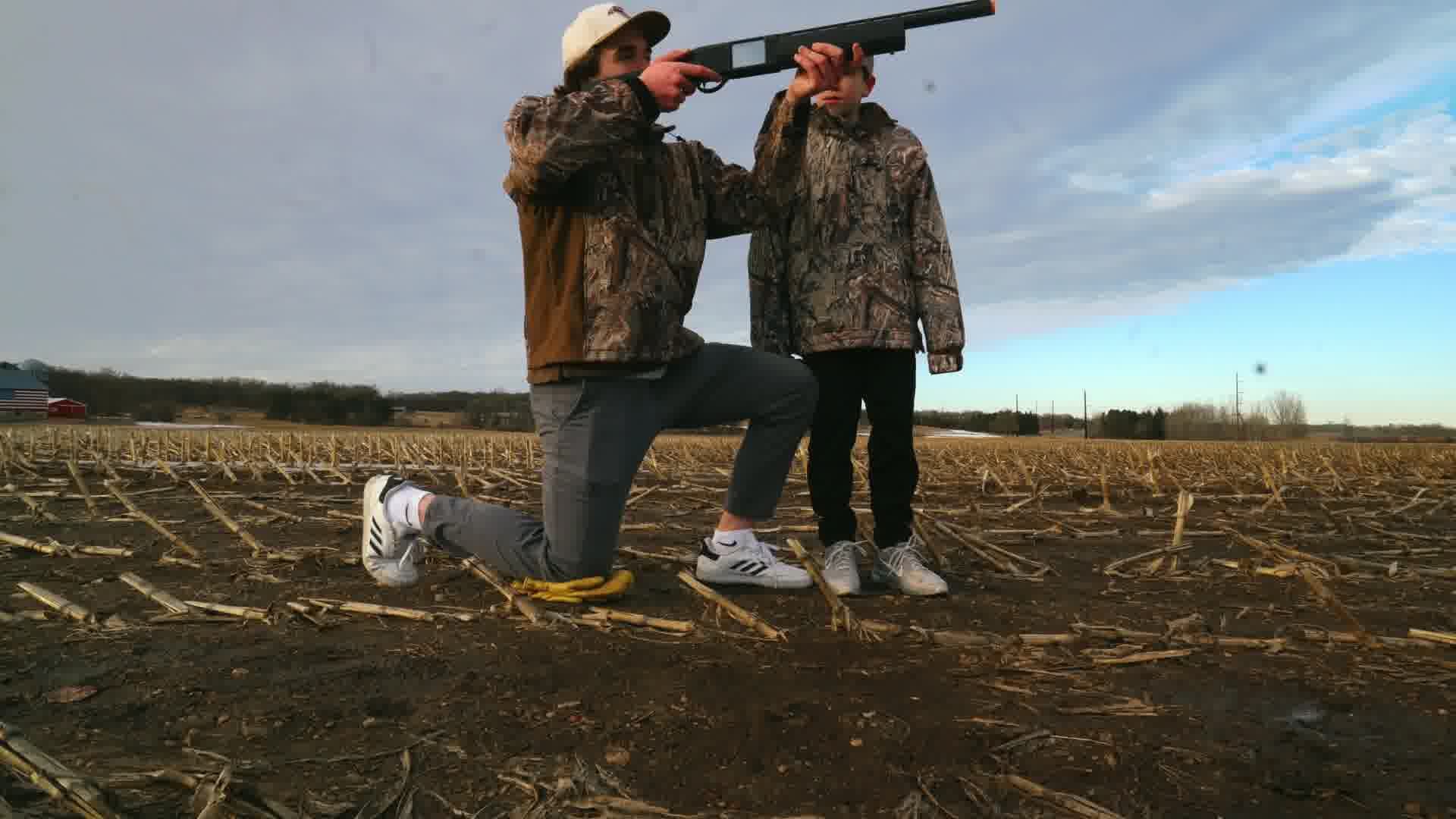 An instructor coaching a young hunter through a safe practice rep