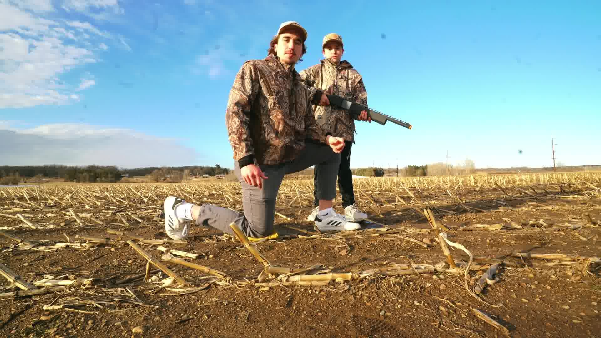 Conner Couet with a young hunter and the Junior Hunter Gun prototype in a Minnesota field
