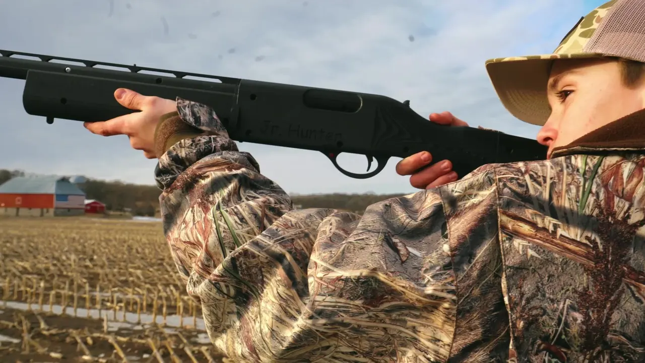 A young hunter safely mounting the Junior Hunter Gun prototype in a Minnesota field